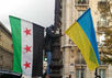Флаги Сирии и Украины на акции в Париже. Фото: Грани.Ру