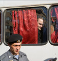 Лидер "Красного блицкрига" Андрей Морозов  наблюдает за концертом из омоновского автобуса. Фото Борко/Грани.Ру