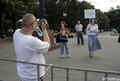 4. Несколько человек с видеокамерами старательно запечатлевают всех участников митинга. Фото Д.Борко/Грани.Ру