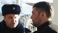 Эдем Семедляев и полицейский. Фото Александры Ефименко для Граней.Ру