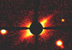 Видимое изображение околозвёздного диска у близлежащей молодой звезды AU Microscopium, обнаруженного с помощью 2,2-метрового тел