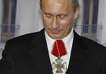 Владимир Путин с Орденом мужества. Коллаж Граней.Ру