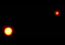 "Двойная планета" - система Плутон-Харон. Снимок "Хаббла". Плутон - слева, а Харон - справа. Фото ESA/ESO и NASA с сайта web.mit.edu