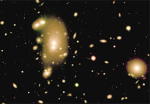 Изображение галактического скопления Abell 3266, которое расположено на расстоянии 250 миллионов световых лет от Земли, было получено с помощью спектрографа GMOS, установленного на телескопе Gemini South. Это одно из самых густонаселенных скоплений галактик в близлежащей части Вселенной. Фото Michael Hudson and Russell Smith (University of Waterloo) and Gemini Observatory
