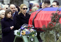 Jovana, left, daugher and Ruzica, widow of assassinated Serbian Prime Minister Zoran Djindjic, follow his coffin during a funera