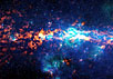 Область галактического центра и Sgr B2. Изображение получено наложением субмиллиметровых данных (красный цвет) и инфракрасных (синий и зеленый). Фото: ESO