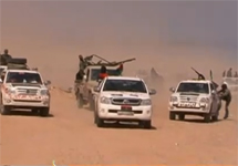 Отступление автоколонны ливийских повстанцев. Кадр "Аль-Джазиры"