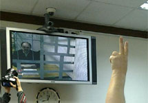 Кривов на экране в зале суда. Фото Д.Борко/Грани.Ру