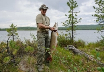 Владимир Путин со щукой. Фото пресс-службы Кремля.