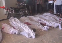 Тела погибших при налете на поселок Тальбиса под Хомсом, 30.09.2015. Кадр видео с youtube-канала talbisa h