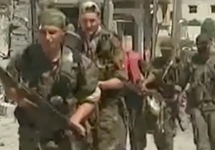 Солдаты Сирийского Курдистана в Ракке. Кадр видео Reuters