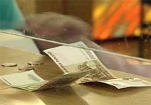 Деньги на кассе. Фото с сайта www.online.sovtest.ru