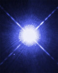 Белый карлик Сириус B виден как точка в левой нижней части снимка, полученного с помощью "Хаббла". Период его обращения вокруг более крупного и яркого компаньона Сириуса A (в центре) составляет 50 лет. Изображение NASA с сайта hubblesite.org