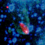This composite X-ray (red/white) and optical (green/blue) image reveals an elongated cloud, or cocoon, of high-energy particles