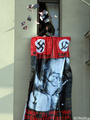 Провокаторы выбрасывают листовки со свастиками из окон гостиницы "Метрополь". Фото Граней.Ру