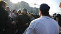 Илья Гущин за спиной полицейского. Кадр видеозаписи "184 задержания" из "Болотного дела"